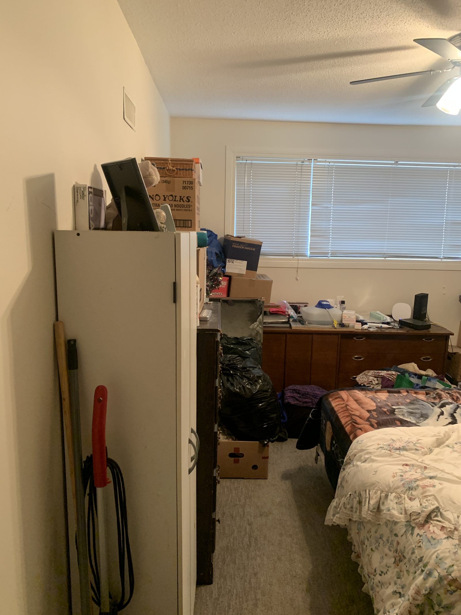 Bedroom before renovation at Acadia Apartments